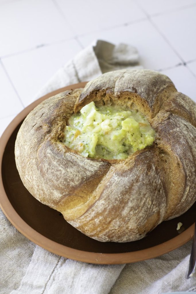 close up of Panera copy cat broccoli cheddar soup in a bread bowl