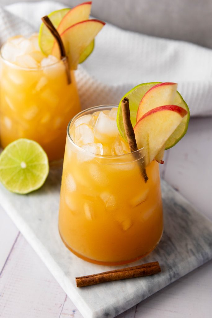 glasses of sparkling apple cider mocktail next to each other
