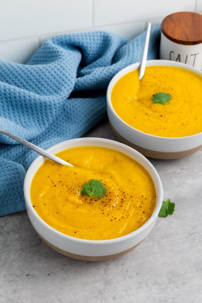 two bowls of butternut squash soup