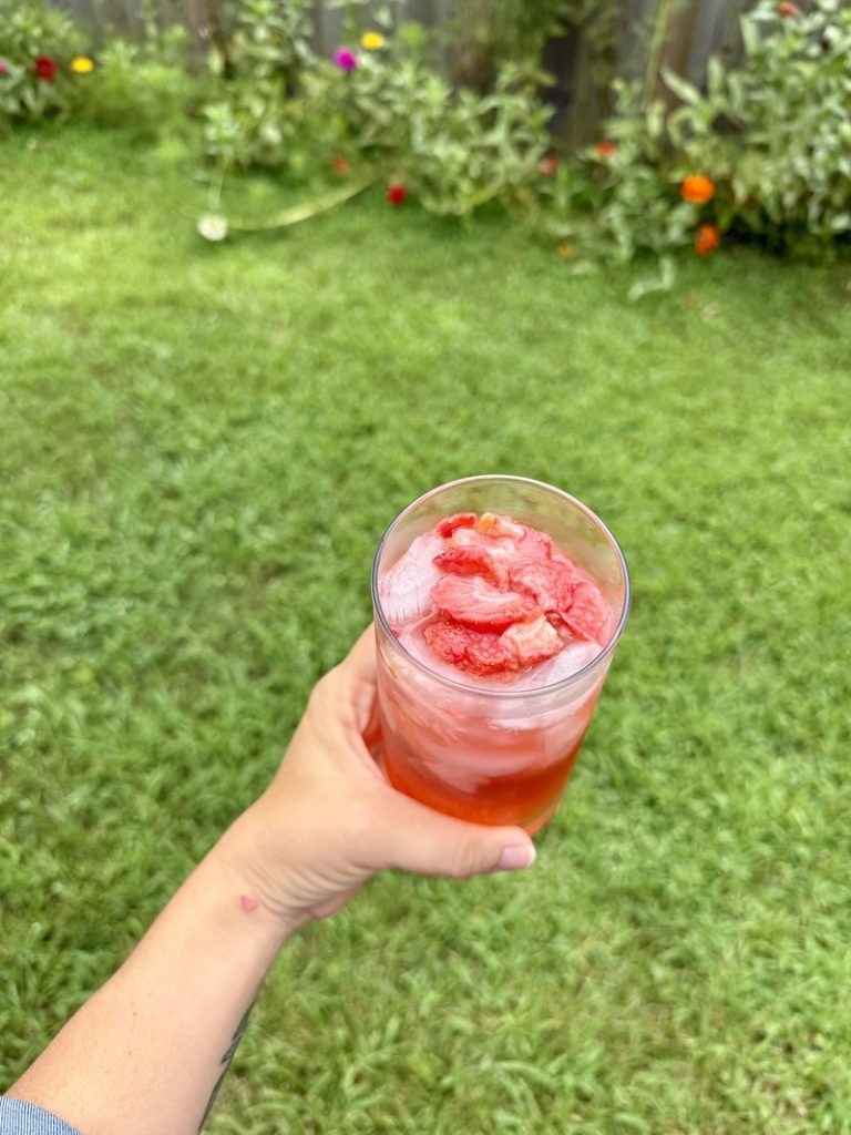 top down of strawberry acai refresher in a glass at home