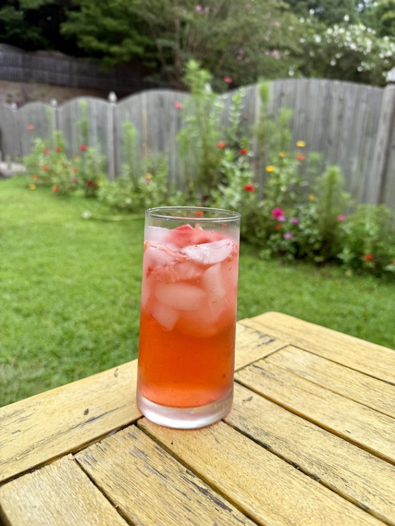 Strawberry acai refresher on table outside 