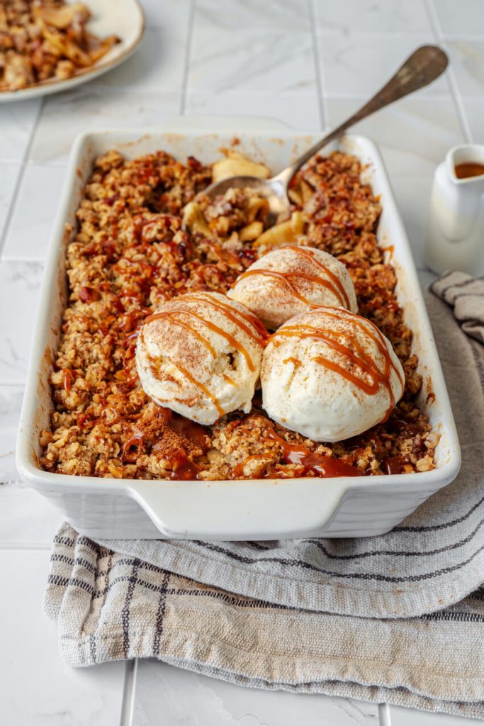 cooked apple crisp with vanilla ice cream