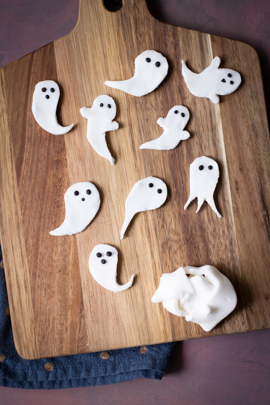 image shows sugar ghosts on a cutting board