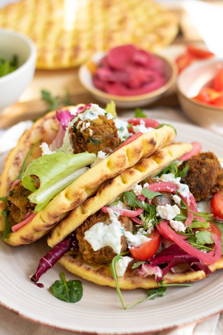 image shows falafel sandwiches on a plate