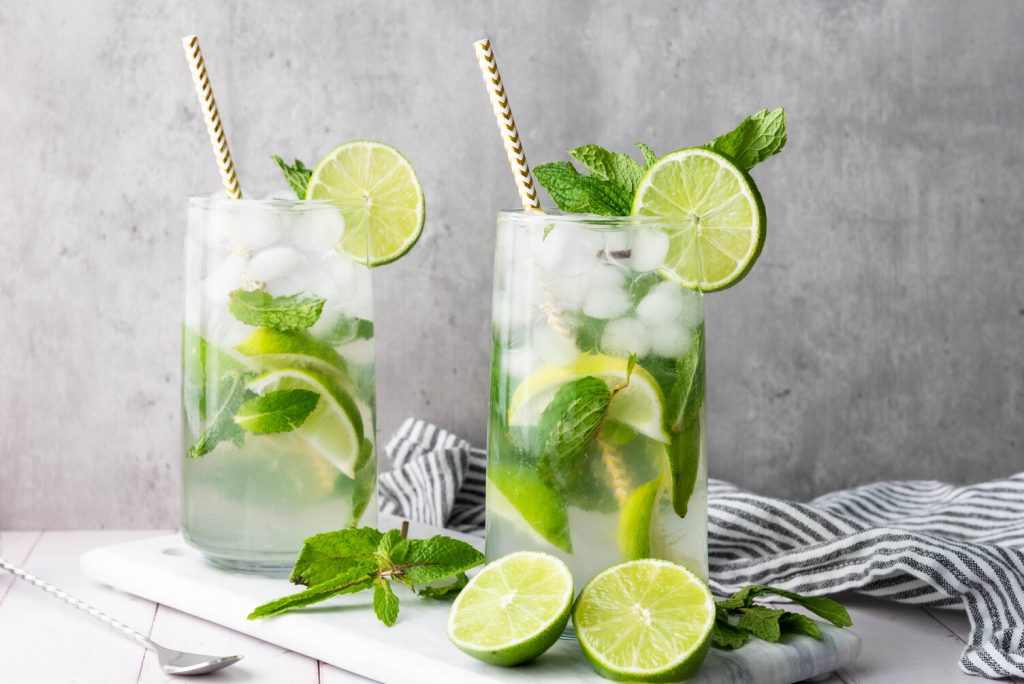 image shows two mojito mocktails